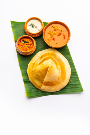 Cone shape dosa, also called dosai, dosey, or dosha, is a thin pancake in South Indian cuisineの写真素材