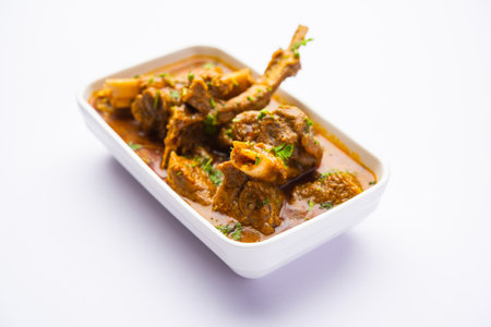 Indian style Mutton OR Gosht Masala OR indian lamb meat rogan josh served with Naanの写真素材