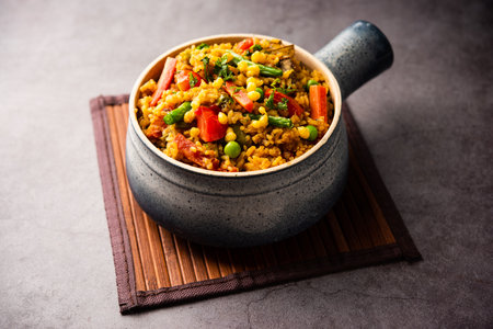 Bisi beleÂ bath or bhath orÂ huliyanna is a spicy, rice based dish from Karnataka, Indiaの写真素材