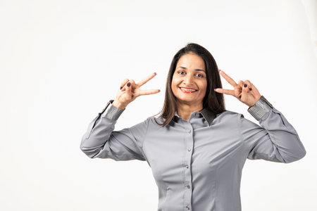 An Indian woman isolated on white background feels proud and self confident, an example to follow.の写真素材