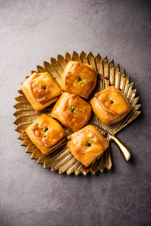 Lavang Latika: traditional Indian sweet. Crescent shape, deep-fried, soaked in sugar syrup. Served during festivals.の写真素材