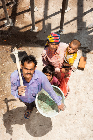 Portrait of an Indian asian labour family working at construction siteの写真素材