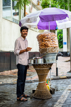 panipuri shop -happy young male Indian roadside vendor selling golgappeの写真素材