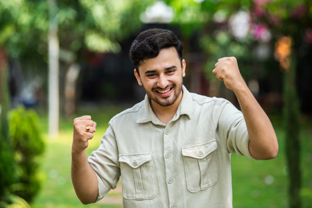 Handsome Indian young man posing for photograph outdoorsの写真素材