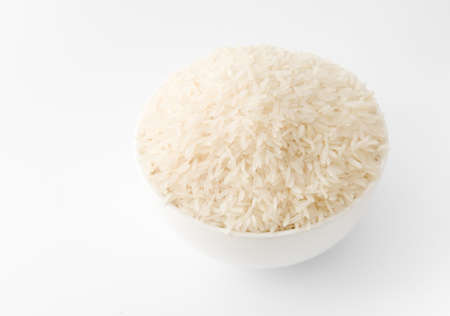 White Rice in White Bowl on White Backgroundの写真素材