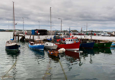 Several boats in the sea in cloudy dayの写真素材