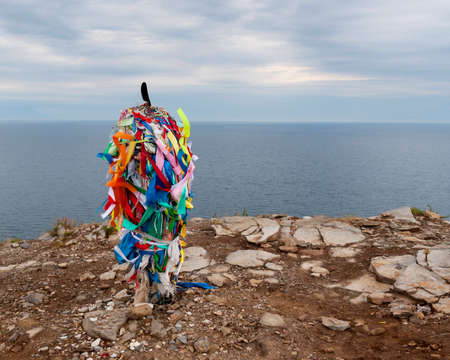 Buddhism stupa on the edge of the rock in cloudy dayの写真素材