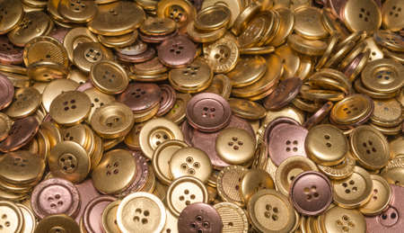 Many Gold and Brone coloured buttonsの写真素材