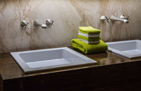 Luxury Double  Bathroom Sink with Green & White Tiles in the Centreの写真素材