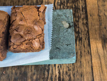 Freshly Made Chocolate Brownies Presented on Wooden Tableの写真素材