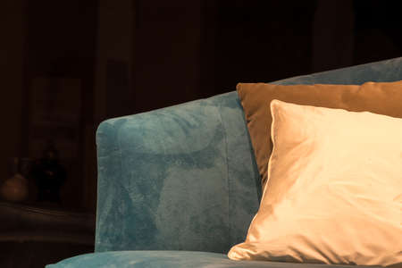 Light Blue Sofa with Briown & Biege Cushions