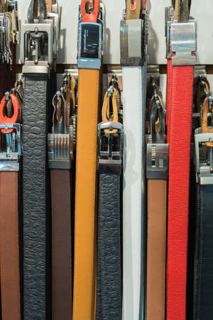 Collection of Colorful Belts on Rack (No Brand Names)の写真素材