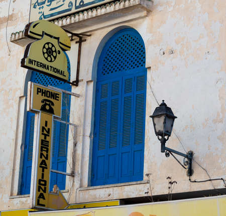 International Telephone Call Sign on outside of old building