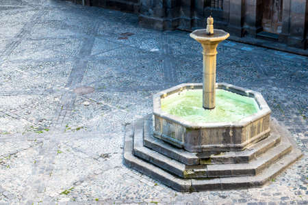 Solid Geometric Fountain in Courtyardの写真素材