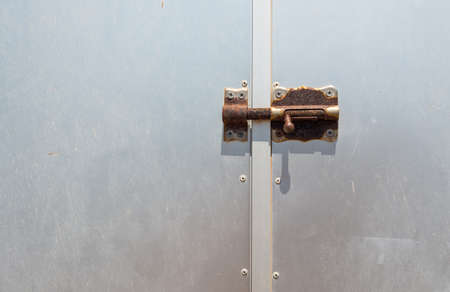 Smooth Metal Door with Locked Rusty Bole