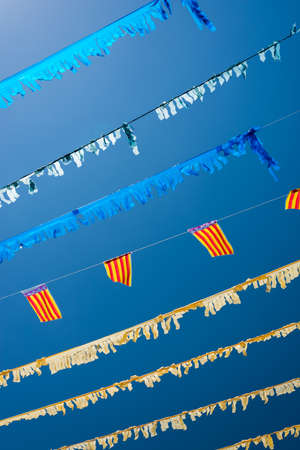 Colorful Festive Bunting across Street In Spanish Villageの写真素材