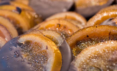 Sliced Oranges Dipped in Chocolate.の写真素材