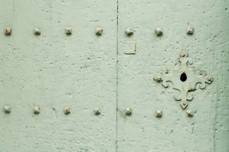 Solid Green Wooden Painted Door and Metallic Lockの写真素材