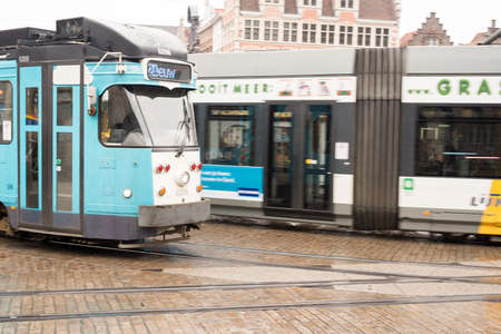 March 2015- Ghent, Belgium - Moving Tram on Cobbled Street .のeditorial素材