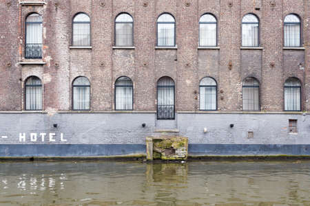 Ghent, Belgium , 4 April 2015 - Charming Hotel Facade looking out over canal waterのeditorial素材