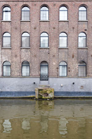 Ghent, Belgium , 4 April 2015 - Charming Hotel Facade looking out over canal waterのeditorial素材