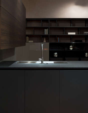 Clean and Minimalist Kitchen Cabinets and Worktop with Stainless Steel Kitchen Sinkの写真素材