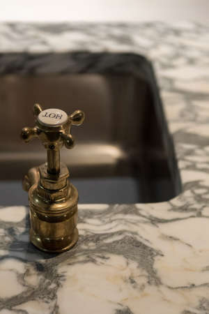 Stylish Brass Faucets and Luxury Marble Basin Sinkの写真素材
