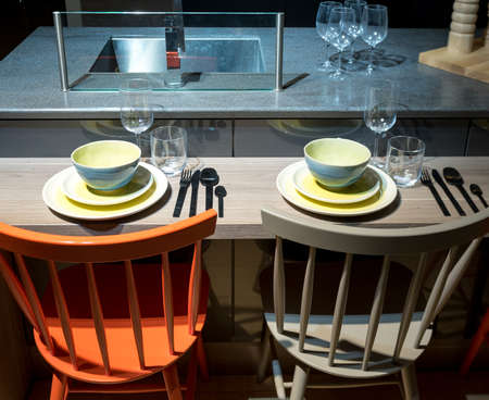 Contemporary and Stylish Kitchen Breakfast Bar with Crockery and Utensilsの写真素材