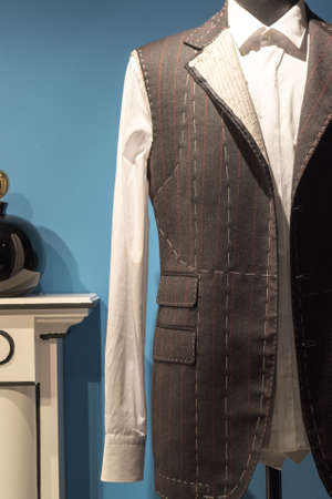 Work in Progress Suit on Mannequin with Exposed Stitching