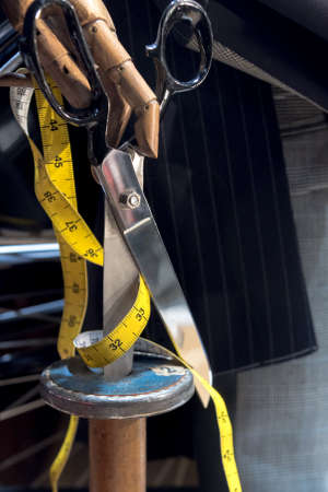 Tailors Scissors, Yellow Measuring Tape and Clothing Swatchesの写真素材