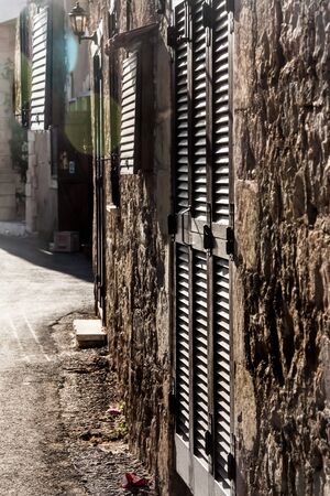 the prospect of the form of the old street to the entrance of the houseの写真素材