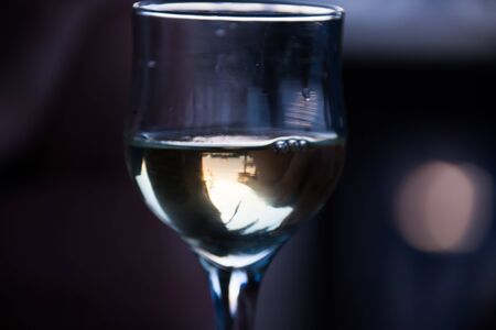 a glass of wine at night romantic rendezvousの写真素材
