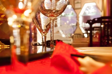 a glass of wine on the tableの写真素材