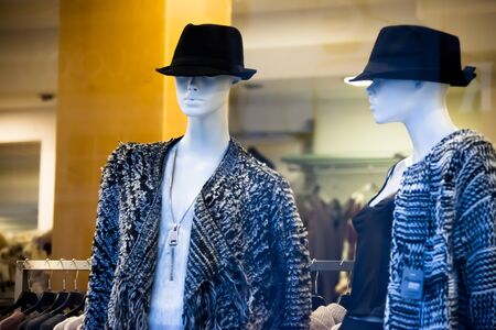 fashionable clothes on mannequins in shop hatsの写真素材