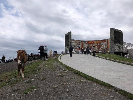 Tourists on the path to Russia-Georgia Friendship Monument