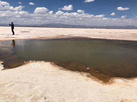 Salty water from underground at Salar de Uyuni salt flats in Bolivia