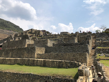 Tourist visits Machu Picchu ruins. Machu Picchu is a UNESCO World Heritage Site