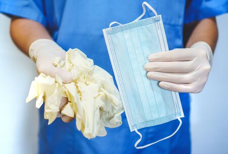 Healthcare professional claiming gloves and masksの写真素材