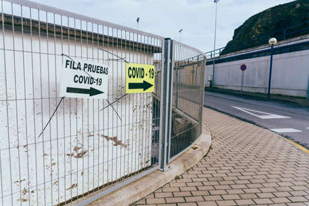 Informative signs on the street to perform the  test in times of pandemic in Spain.