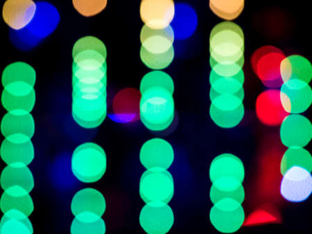 Abstract pattern of colour blurred bokeh neon lights at night clubの写真素材