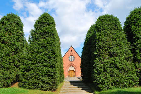 Small church hidden in the forest of Sandsborg, Stockholm suburb. Swedenの写真素材