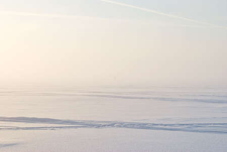 Sunset winter fog over the Finnish bayの写真素材