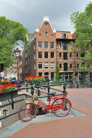 Amsterdam. Beautiful  bridge decorated with flowers over  the canal Brouwersgrachtの写真素材