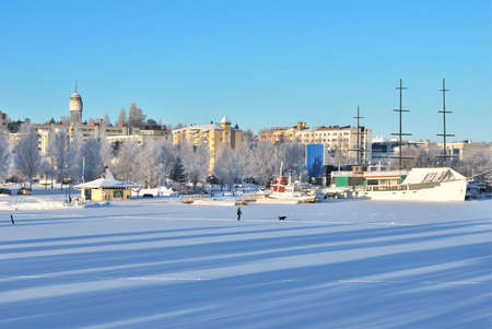 Finland. View of the town of Mikkeli and frozen lake in a sunny winter dayの写真素材
