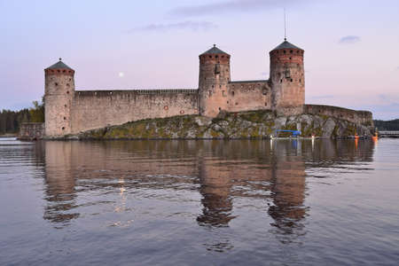 Savonlinna, Finland. Ancient fortress Olavinlinna after sunsetのeditorial素材