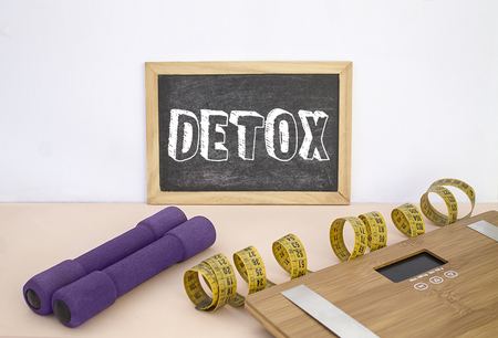 Blackboard with message Detox Time, weights, tape and scaleの写真素材
