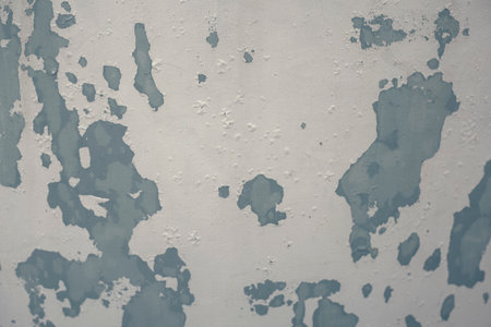Photograph of a painted surface with a paint stain. Texture and wallpaper. painted wall, painted wallの写真素材