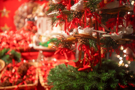 Detail of Christmas decoration ornaments in a Christmas market stall in SchÃ¶nbrunn Palace, Vienna, Austria, during the night. Birds in a nestの写真素材