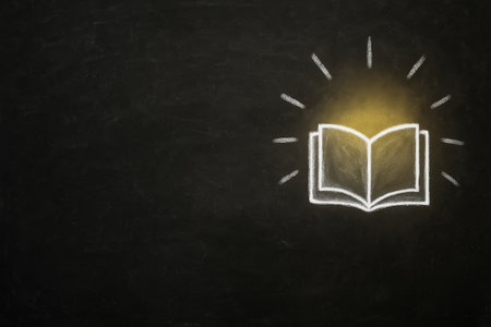 High-resolution stock photo of a blackboard with a chalk drawing of an open book. Concept image representing education, learning, and knowledge. Minimal style with wide copy space for school, academic, or business text and branding.の素材
