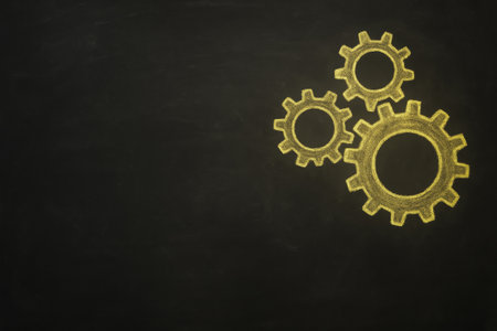 High-resolution stock photo of a blackboard with chalk-drawn gears in yellow. Concept image representing teamwork, collaboration, productivity, and efficiency. Minimal composition with large copy space for business, educational, or motivational text and branding.の素材